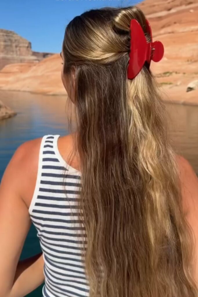 half-up claw clip is a stylish but cute back to school hairstyle