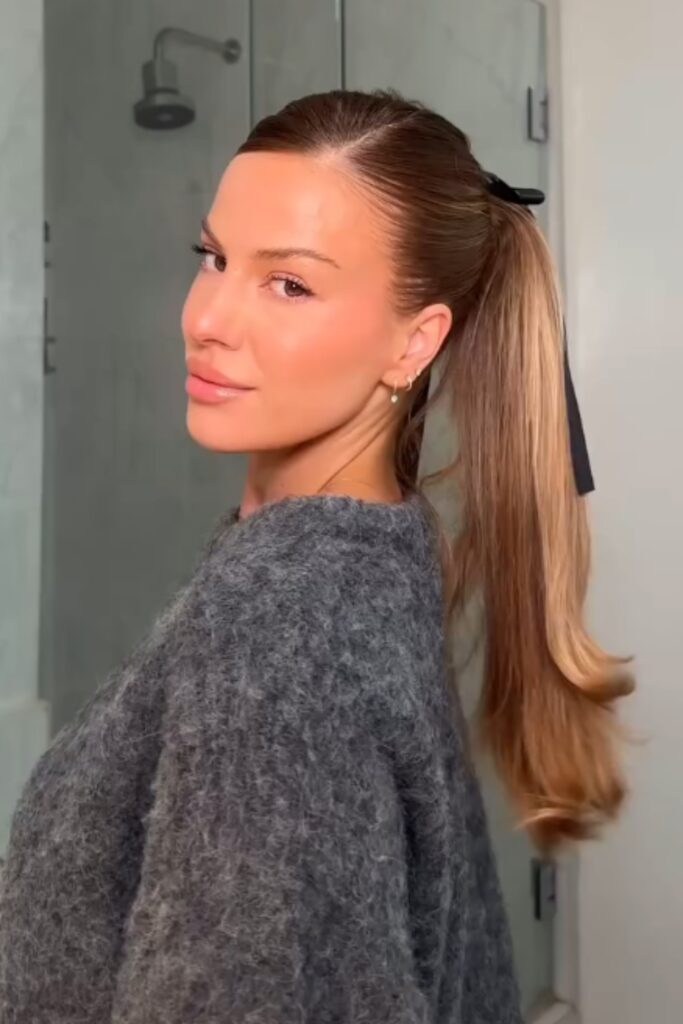 ponytail dressed up with a ribbon tied around the base feels sweet, nostalgic, and just a little bit special hairstyle for back to school