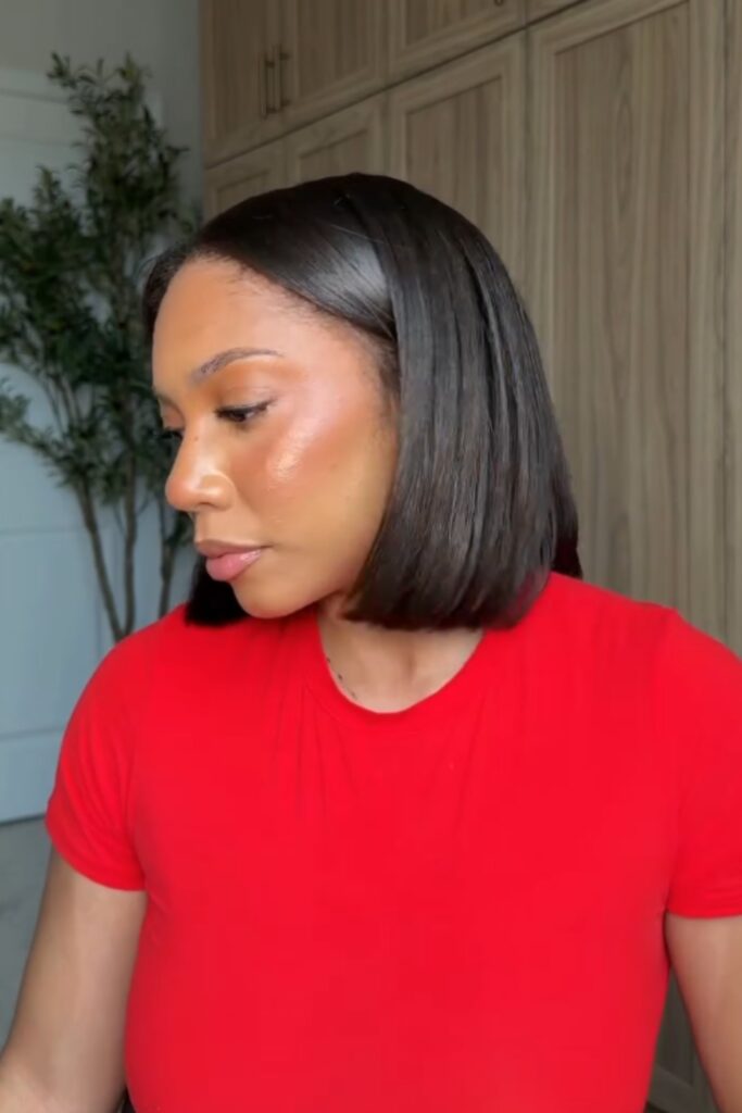 woman in a red dress sporting a silk press, one of the easiest natural hair back to school hairstyles 