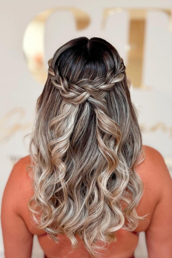 Braided crown half-up on balayage hair with beachy curls underneath