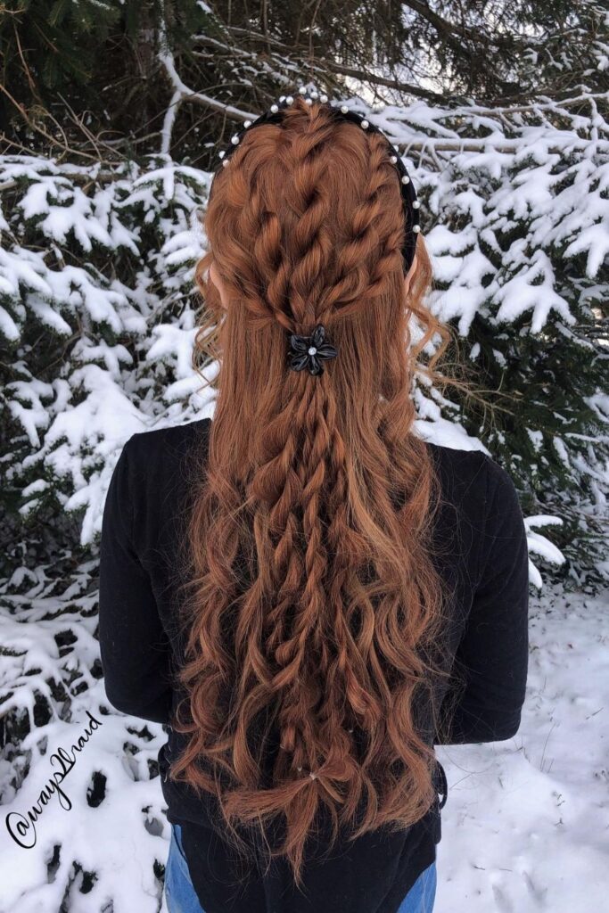 Stacked braids and a pearl headband on long red hair, a braided homecoming hairstyle