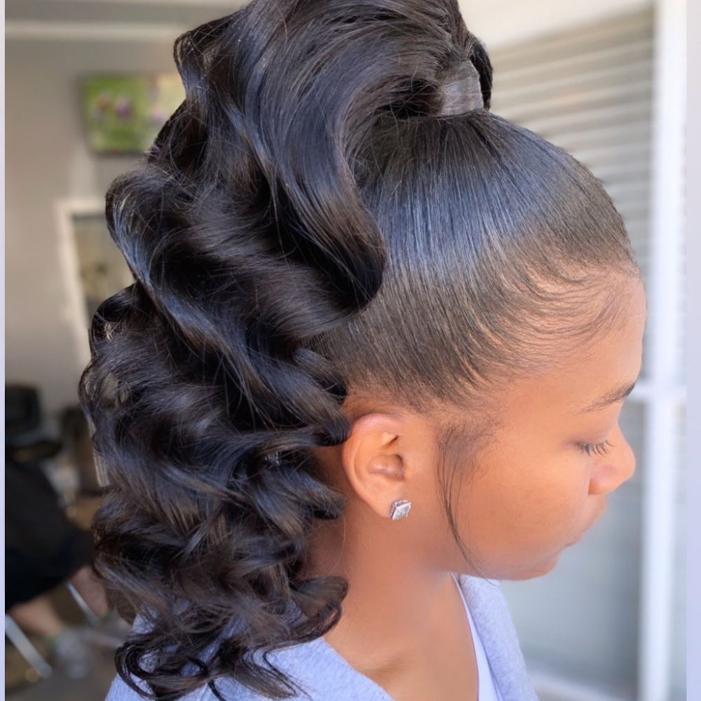 High curled ponytail with laid edges, a hoco hairstyle for Black women