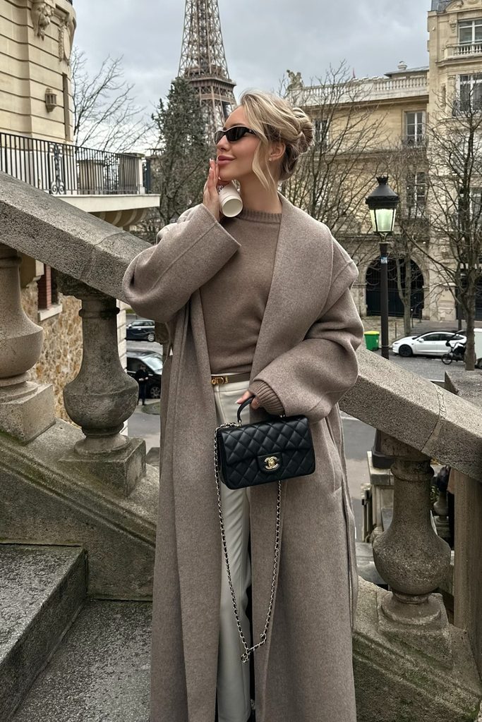 Oversized taupe wool coat with a matching sweater and cream trousers, a chic autumn outfit