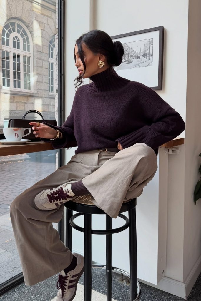 Plum turtleneck sweater with taupe trousers and retro sneakers, a fall outfits aesthetic idea
