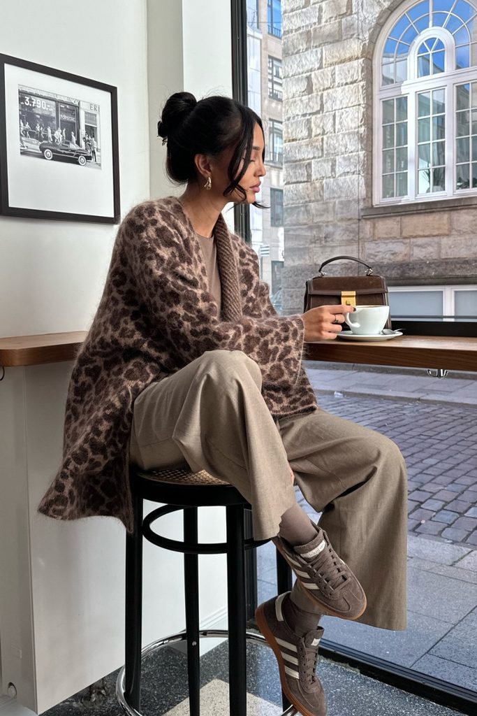 Leopard print cardigan with neutral trousers and sneakers, a playful print to add to your fall rotation