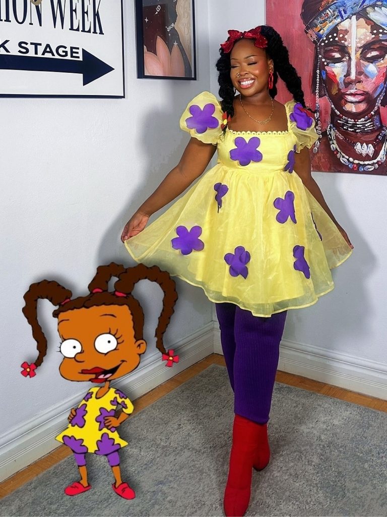 Woman wearing a yellow floral tulle dress and red boots inspired by Rugrats.
