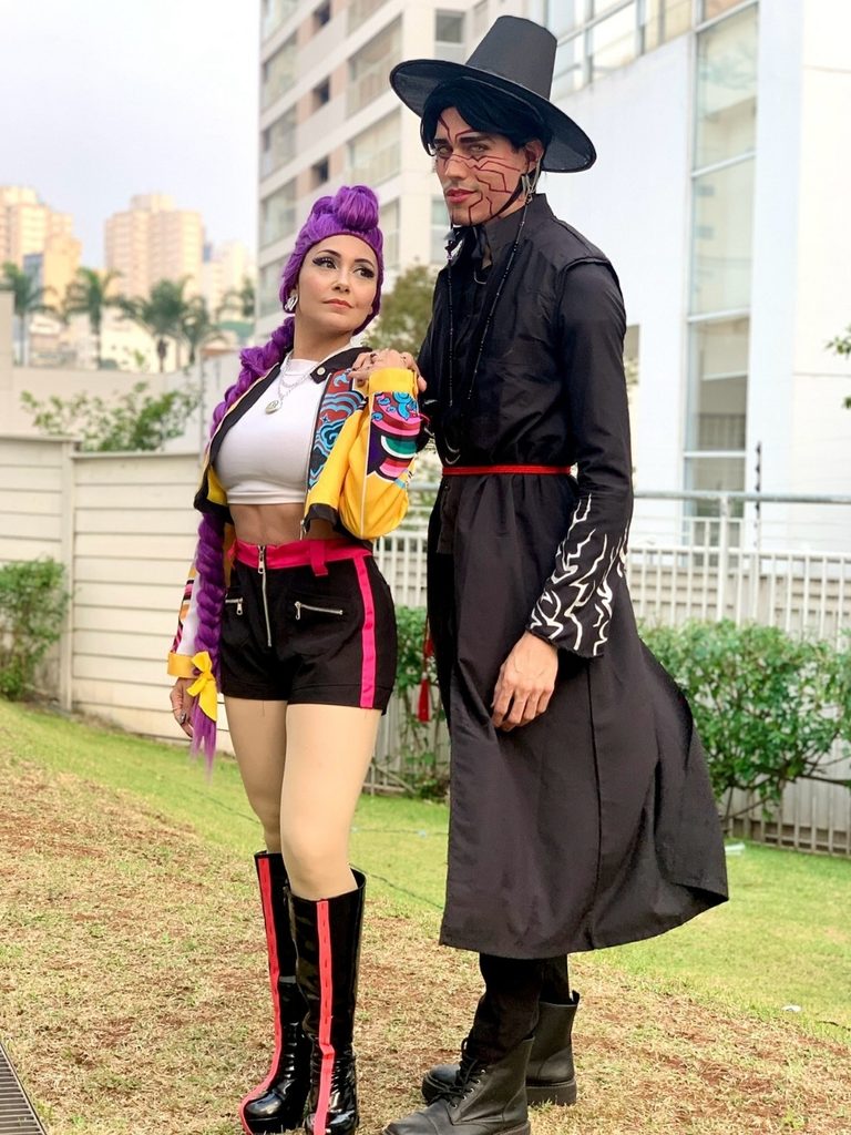 Couple dressed as Rumi and Jinu from KPop Demon Hunters.