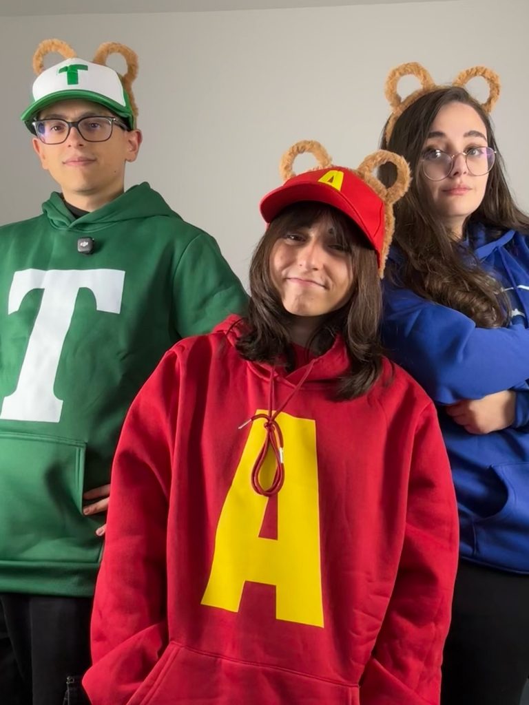 Group of friends dressed as Alvin and the Chipmunks in matching hoodies.