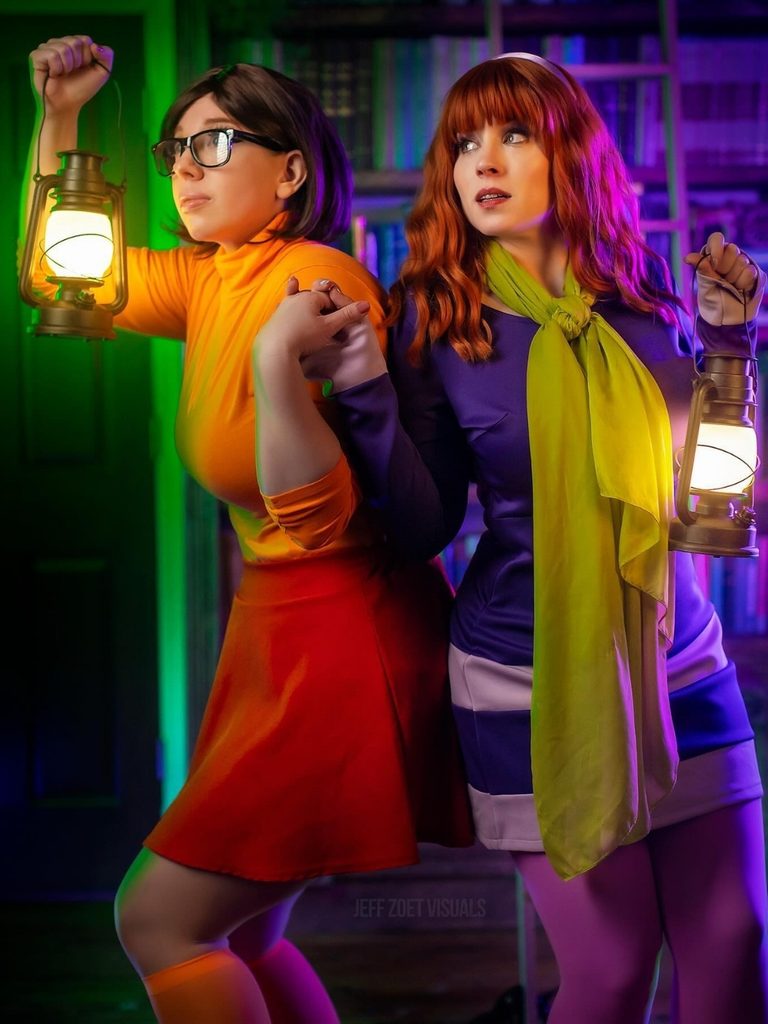 Two friends dressed as Velma and Daphne from Scooby-Doo.