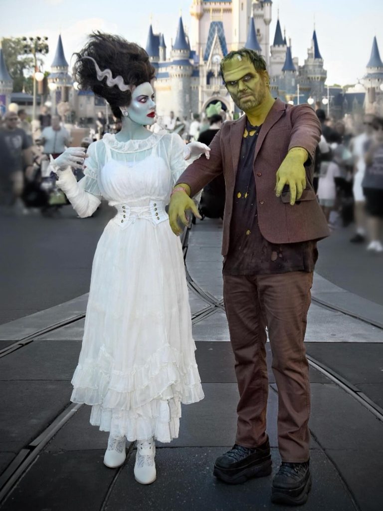 Couple dressed as Frankenstein's monster and his bride in classic monster-inspired outfits.