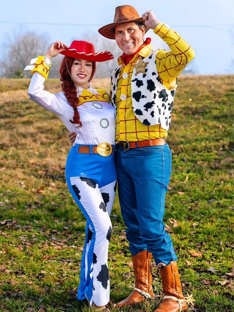 Couple dressed as Woody and Jessie from Toy Story in cowboy hats and denim.