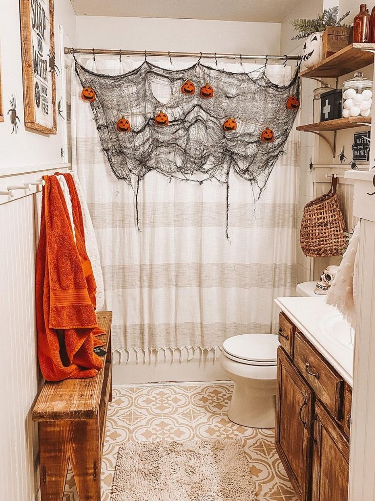 Shower decorated with cheesecloth and small pumpkins
