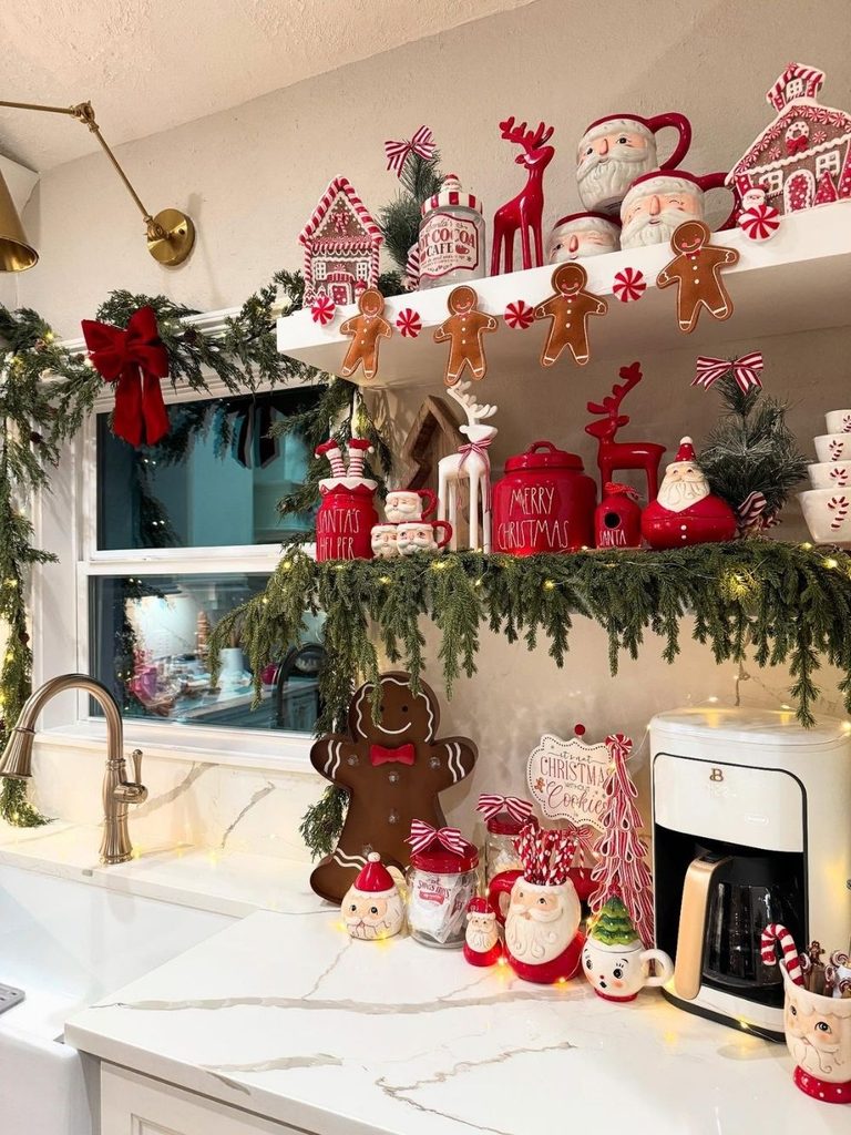 Kitchen coffee station with gingerbread garland, Santa figurines, and greenery above the sink