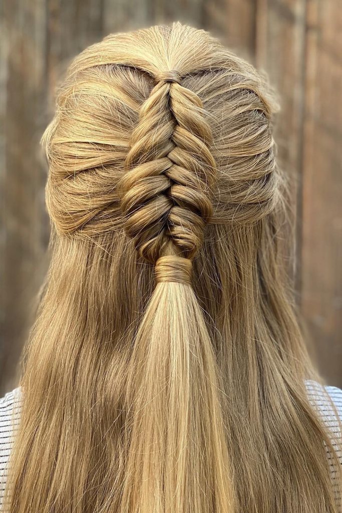 Half up half down hair braid with a Dutch fishtail at the center back