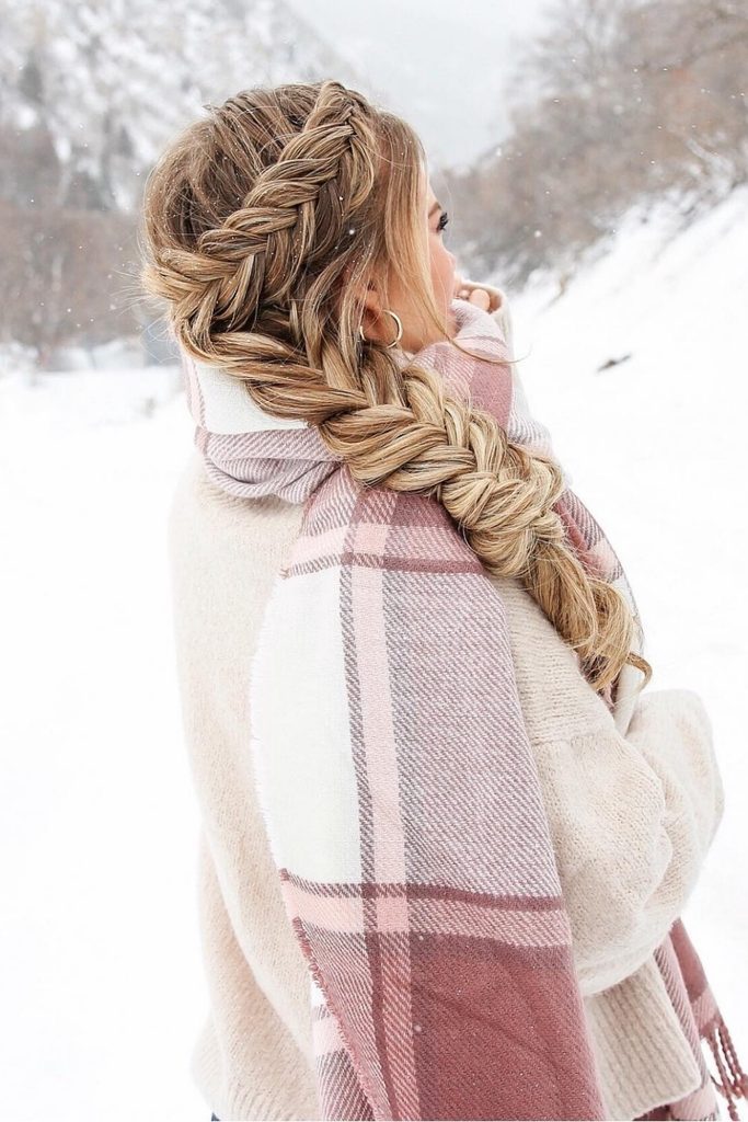 Winter braid hairstyle with a Dutch fishtail side braid and a blush plaid scarf