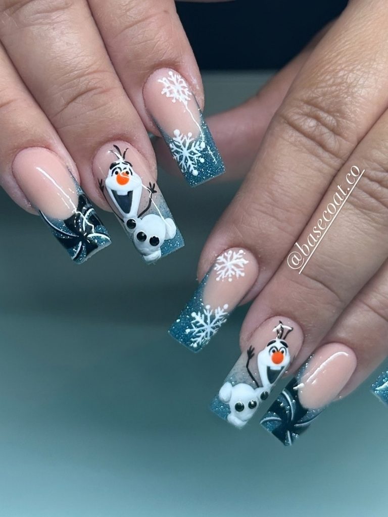 Teal glitter nails with snowmen and white snowflakes