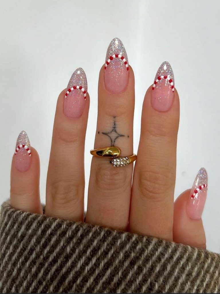 Glitter French tip nails with candy cane stripes
