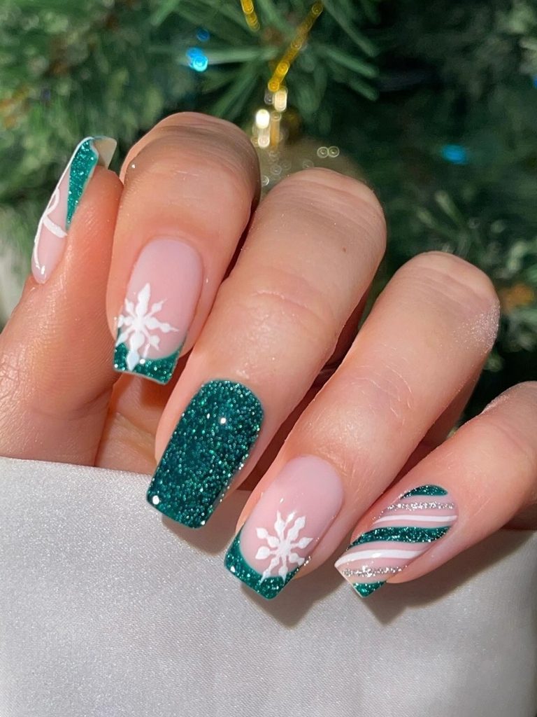 Emerald glitter French tip nails with white snowflakes