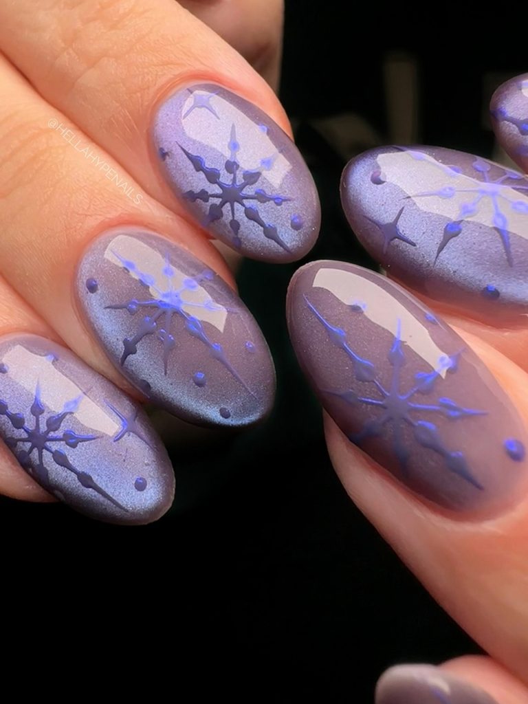 Lavender gray snowflake nails with a shimmery jelly finish