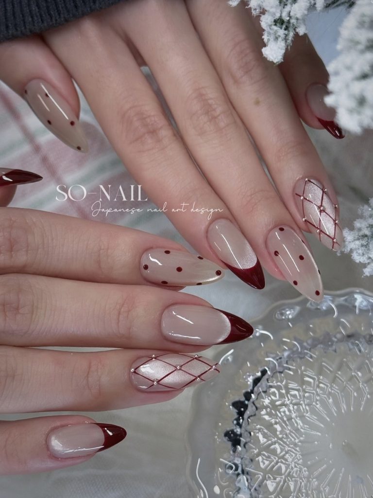 Argyle nails with burgundy French tips and polka dots