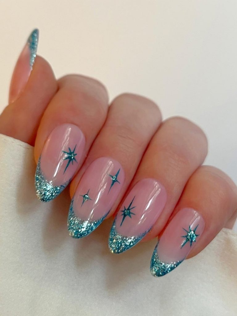 Teal glitter French tip winter nail art with stars