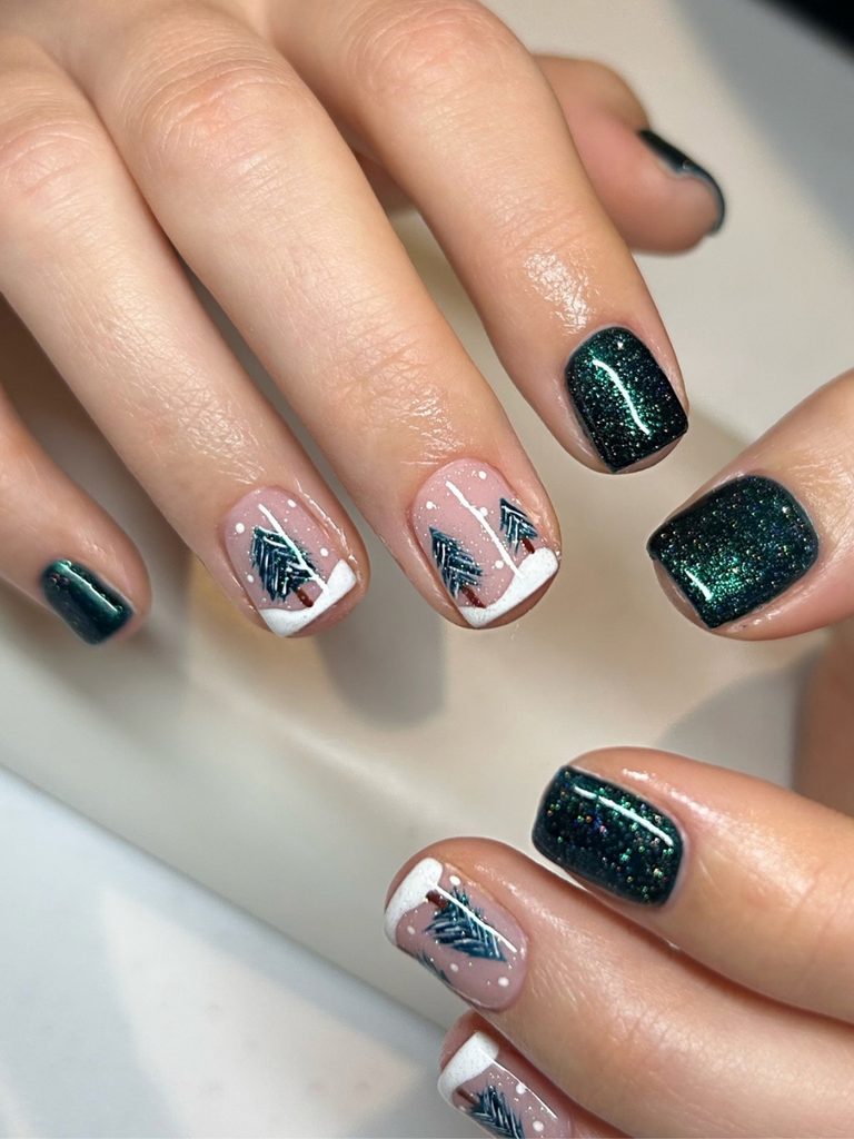 Short dark green nails with tiny Christmas trees