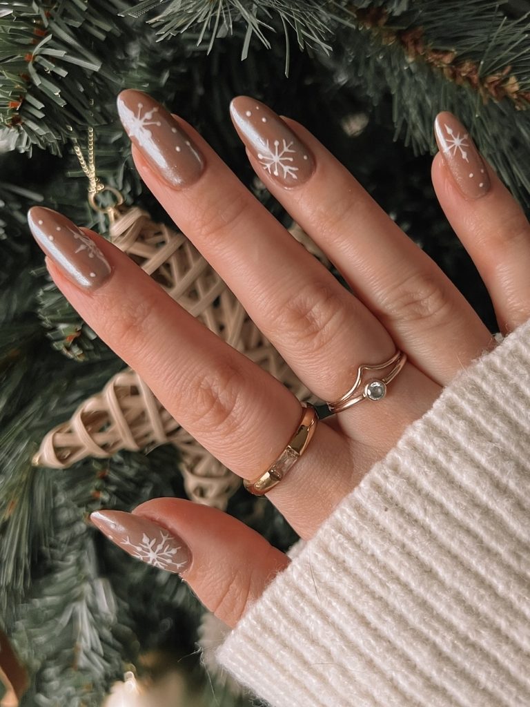 Mocha snowflake nails on long almond shapes