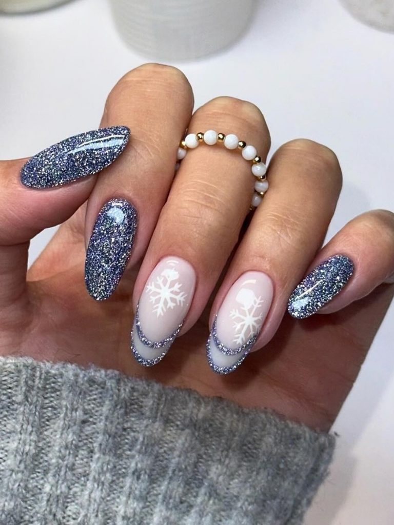 Denim blue glitter nails with snowflake accents