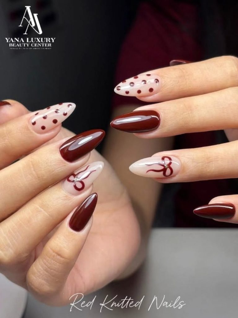 Burgundy ribbon nails with polka dots on nude